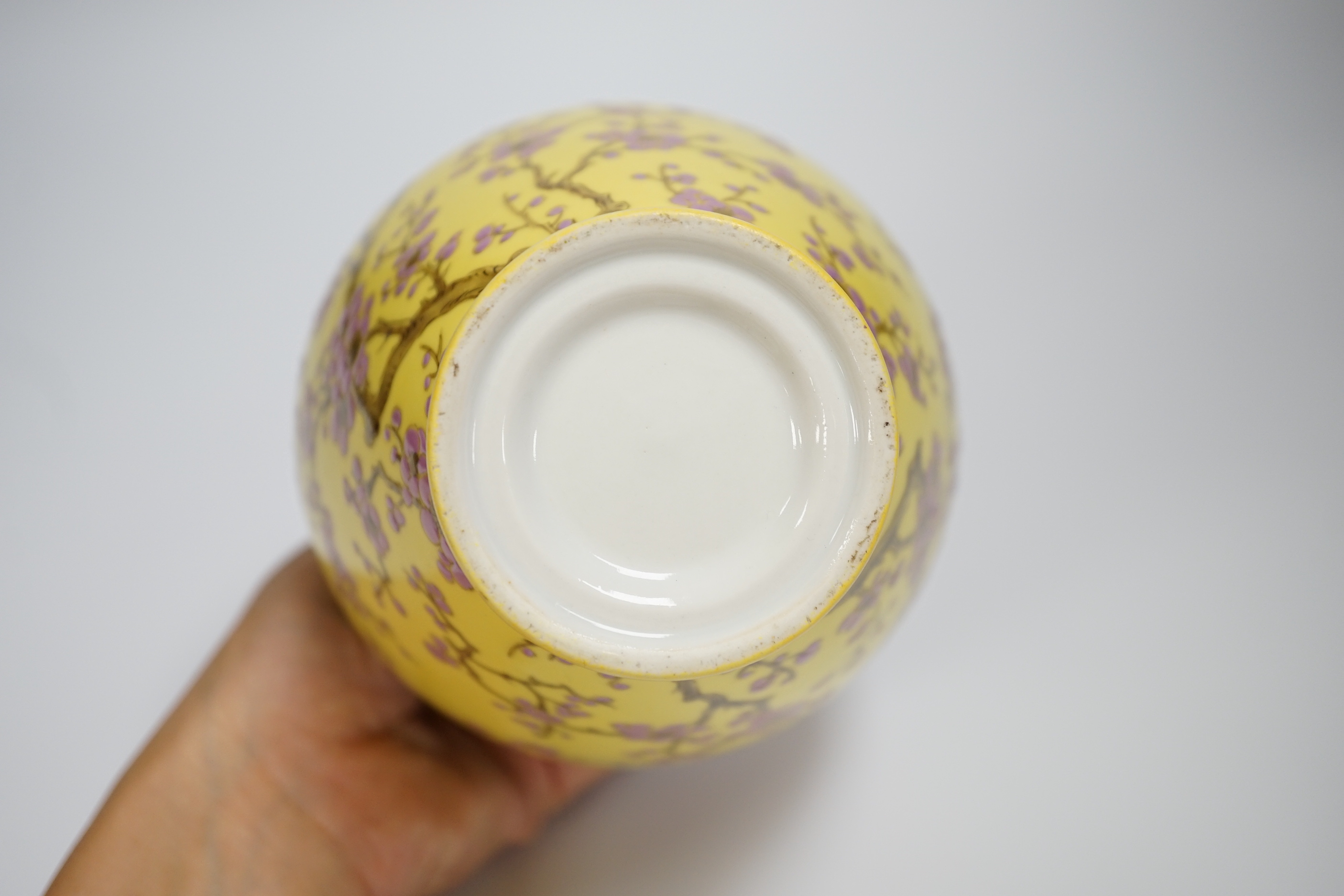 A Japanese yellow ground vase with pink cherry blossom design, 16cm